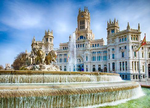 Famous Cibeles Fountain on a sunny day in Madrid.